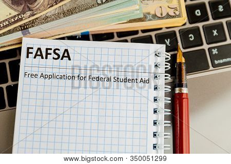 Fafsa In The Notebook And Money Near.