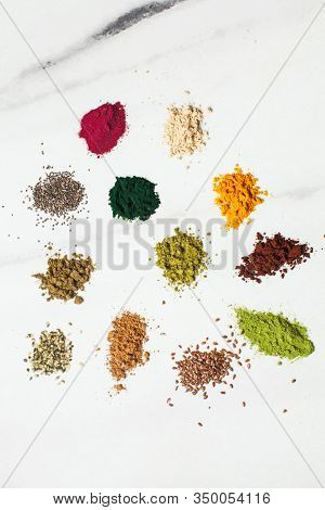 Top View Various Dietary Supplements Scattered On The Table