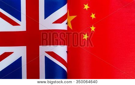 Fragments Of National Flags Of Great Britain And China Close-up