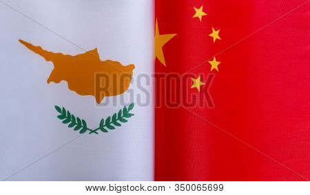 Fragments Of The National Flags Of The Republic Of Cyprus And China In Close-up