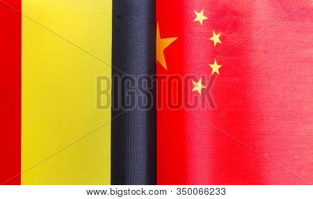 Fragments Of National Flags Of Belgium And China Close-up