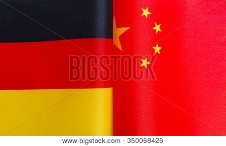 Fragments Of German And Chinese Flags In Close-up