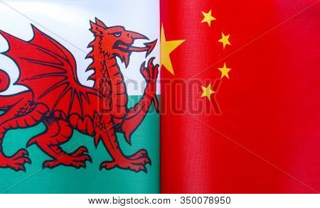 Fragments Of National Flags Of Wales And China Close-up