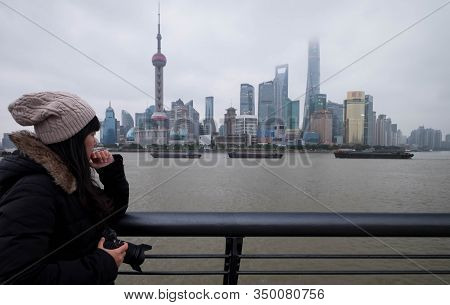 Shanghai, China - January 09 2020: The Unspecific Girl At The Shanghai Waitan 