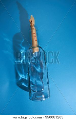 blank massage in a botol on the blue background