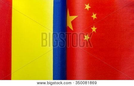 Fragments Of National Flags Of Romania And China Close-up