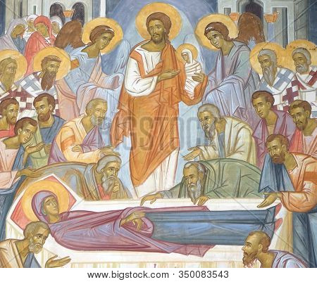 TREBINJE, BOSNIA AND HERZEGOVINA - MAY 01, 2019: Death of the Virgin, fresco at the external wall of the 15th-century monastery Assumption of the Virgin Mary in Tvrdos near Trebinje, Bosnia and Herzeg