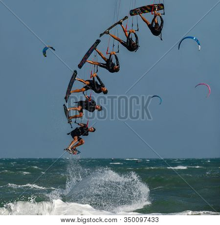 Shooting of Kitesurfing Sequences  on the waves of the sea in Mui Ne beach, Phan Thiet, Binh Thuan, Vietnam. Kitesurfing, Kiteboarding action photos Kitesurfer In action