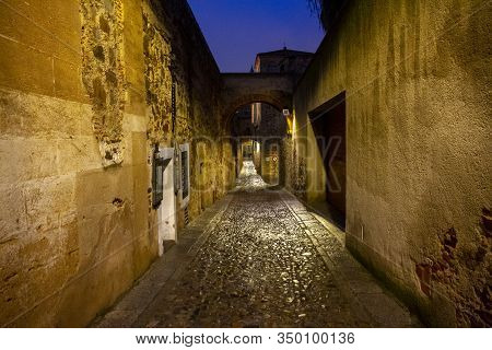 Intramural Street Of The Old Part Of Caceres After The Rain At Night