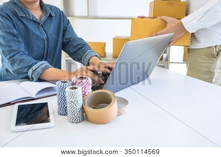 Young Business Owner Work At Home Receive Order Customer And Take Note List With Report And Packing 