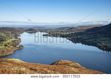 Epic Autumn Fall Landscape Of Ullswater And Surrounding Mountains And Hills Viewed From Hallin Fell 