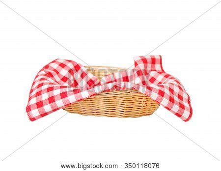 Wicker Basket With A Red Checkered Napkin Inside Isolated On White Background