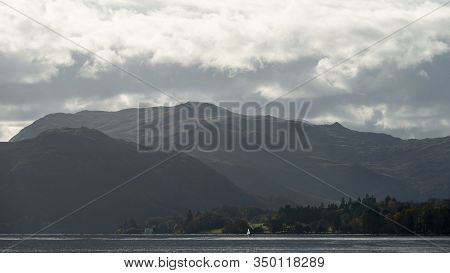 Epic Autumn Fall Landscape Of Ullswater And Surrounding Mountains And Hills Viewed From Hallin Fell 