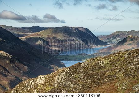 Epic Autumn Fall Landscape Of Buttermere And Crummock Water Surrounded By Mountain Peaks In Lake Dis