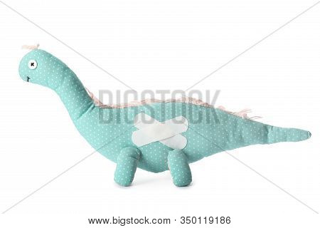 Toy Dinosaur With Sticking Plasters Isolated On White