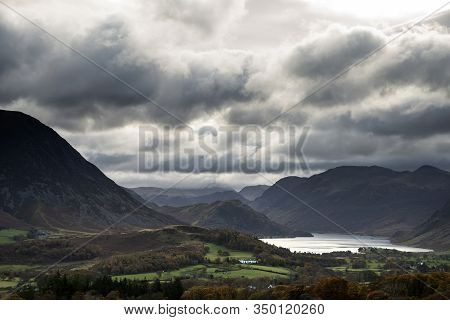 Epic Sun Beams Light Up Crummock Water In Dramatic Autumn Fall Landscape Image With Mellbreak And Gr