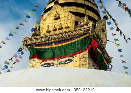 The Upper Part Of The Stupa In Buddhist Temple Swayambhunath In Kathmandu. The Image Of Buddhas Eyes