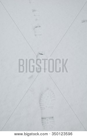 Human Footprints On The Snow, Winter Path The Footprint In Snow And Natural Sunlight