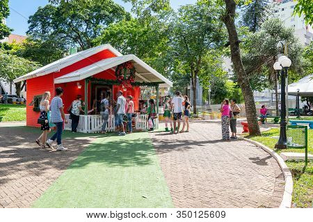 Londrina Pr, Brazil - December 23, 2019: Santa Claus House Being Visited By People At Praca Da Bande