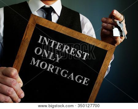 Board With Words Interest Only Mortgage And Key.