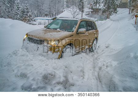 The Car Rides On A Snowy Mountain Road. The Village Of Lumshory, Zakarpattia Region, Ukraine. Februa