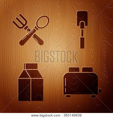 Set Toaster With Toasts , Crossed Fork And Spoon , Paper Package For Milk And Spatula On Wooden Back