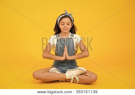 Inner Calmness. Yoga Meditation. Little Child Do Meditation In Healthy Pose. Small Girl Enjoy Medita