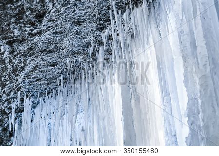 View From Under A Frozen Waterfall, Ice Curtain From Icicles