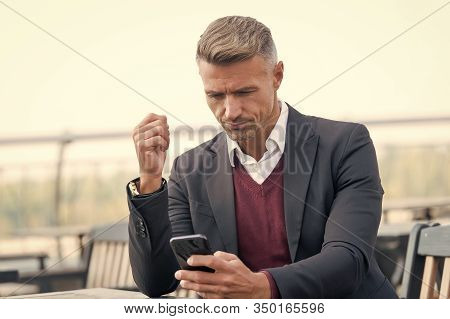 Mobile Is Lifestyle Not Technology. Mature Businessman Use Mobile Device In Cafe. Handsome Man Hold 