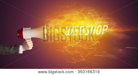 Young girld shouting in megaphone with WEBSHOP inscription, online shopping concept