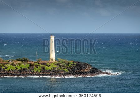 Nawiliwili, Kauai, Hawaii, Usa. - January 17, 2020: Closeup Of Yellow Ninini Lighthouse On Black Oce