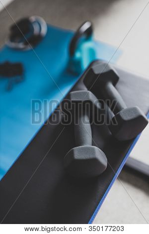 Home Gym And Fit Lifestyle Still-life, Room With Flat Bencha Nd Dummbells Surrounded By Other Fitnes