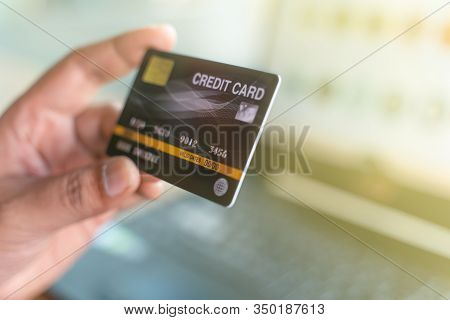 Man Holding Mock Up Credit Card And Laptop Computer For Online Shopping.online Shopping, Online Paym