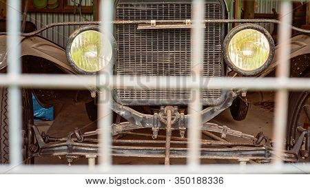 An Old Vintage Car Parked Behind A Fence Making It Off Limits At Historic Homestead Site