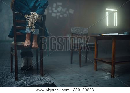 Female victim of maniac kidnapper with tied hands