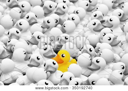 Unique Yellow Toy Duck Among Many Monochrome Ones. Standing Out From Crowd, Individuality And Differ