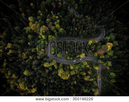 Curvy Mountain Road Winding Through A Colorful Forest In Autumn In Bavaria, Germany