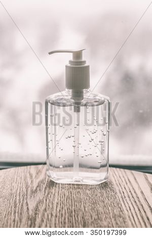 Coronavirus hand sanitizer cleaning gel for washing hands against germs and flu virus. Alcohol based antimicrobial disinfectant product for airport, hospital, healthcare and home.