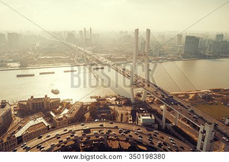 Shanghai Nanpu Bridge over Huangpu River with busy traffic in China.