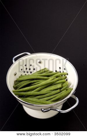 Feijão verde em Collander