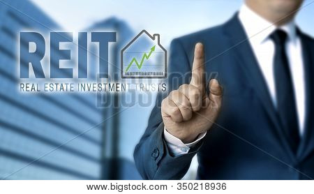 Reit Concept Is Shown By Businessman Design
