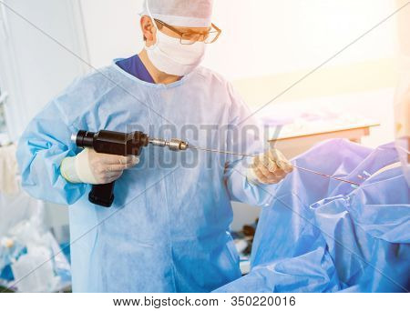 Arthroscope Surgery. Orthopedic Surgeons In Teamwork In The Operating Room