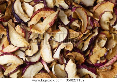 Dried Apple Chips Close-up. Natural Background Of Chips. Organic Natural Food. Top View. Flat Lay.