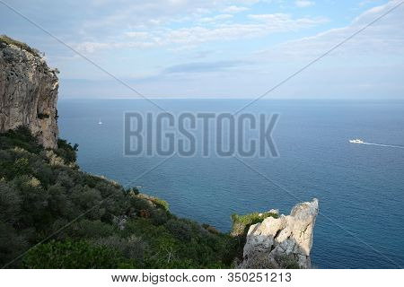 High Impregnable Plateau With Mountain Vegetation On Top And Slopes And Calm Sea Far And Down On Sky