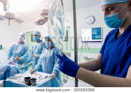 Arthroscope Surgery. Orthopedic Surgeons In Teamwork In The Operating Room