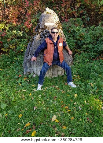 Man Tries To Carry A Prehistoric Megalithic Menhire In Germany