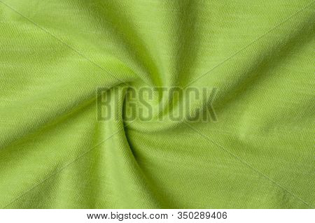 Close-up Fragment Of Crumpled Beautiful Yellow Cotton Fabric. Concept Of High-quality Raw Materials 