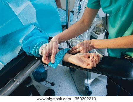 Pulse Oximeter On The Patients Hand. Surgery Equipment