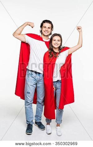 Full Height Young Couple Wear In Super Hero Cout Show The Power Isolated On White Background