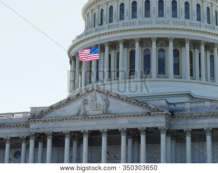 American Flag Half-mast On Top Of The Capitol.